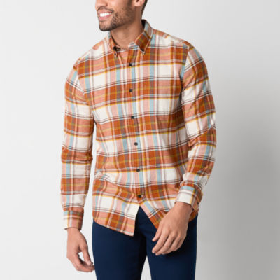 A man wearing an orange and white flannel shirt