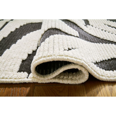 Signature Design by Ashley� Thomwith Washable Indoor Rectangular Area Rug