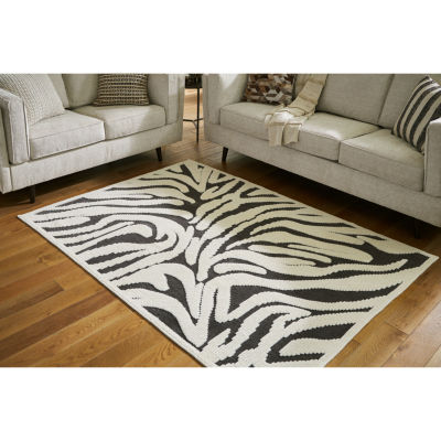 Signature Design by Ashley� Thomwith Washable Indoor Rectangular Area Rug