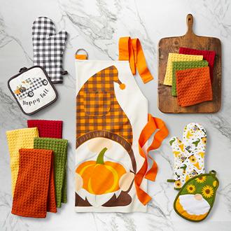 Fall Baking Festive holiday-themed aprons, oven mitts and more.