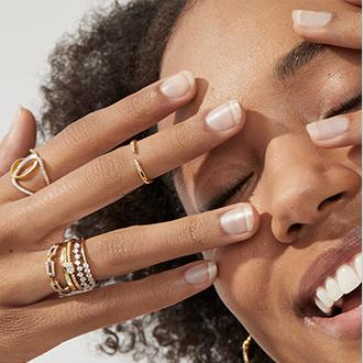 Stack Hack: Add interest with a midi ring, worn  between your fingertip and knuckle.